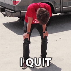 A man in a red shirt bent over with his hands on his knees, captioned I quit